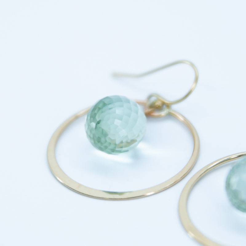 Earring with flattened circle and stone